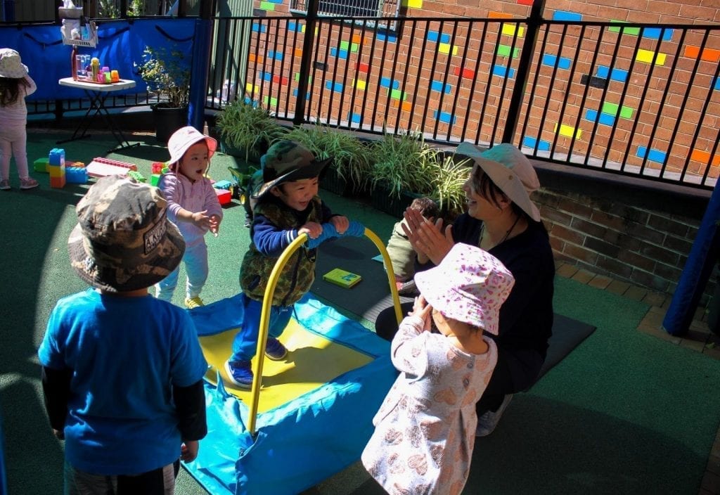 Beverly Hills Montessori Children Playing with Teacher